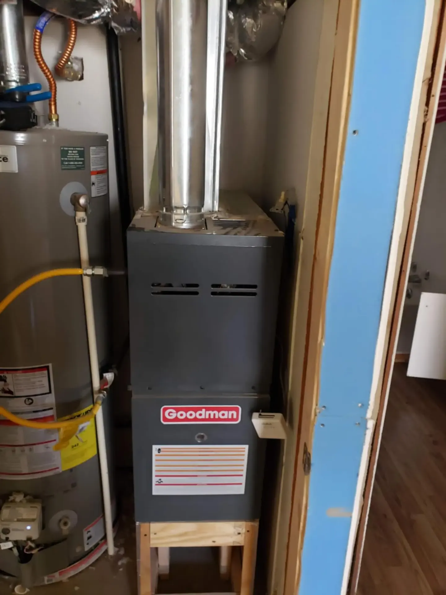 NATE certified technician performing annual furnace maintenance inspection in Claremore attic installation