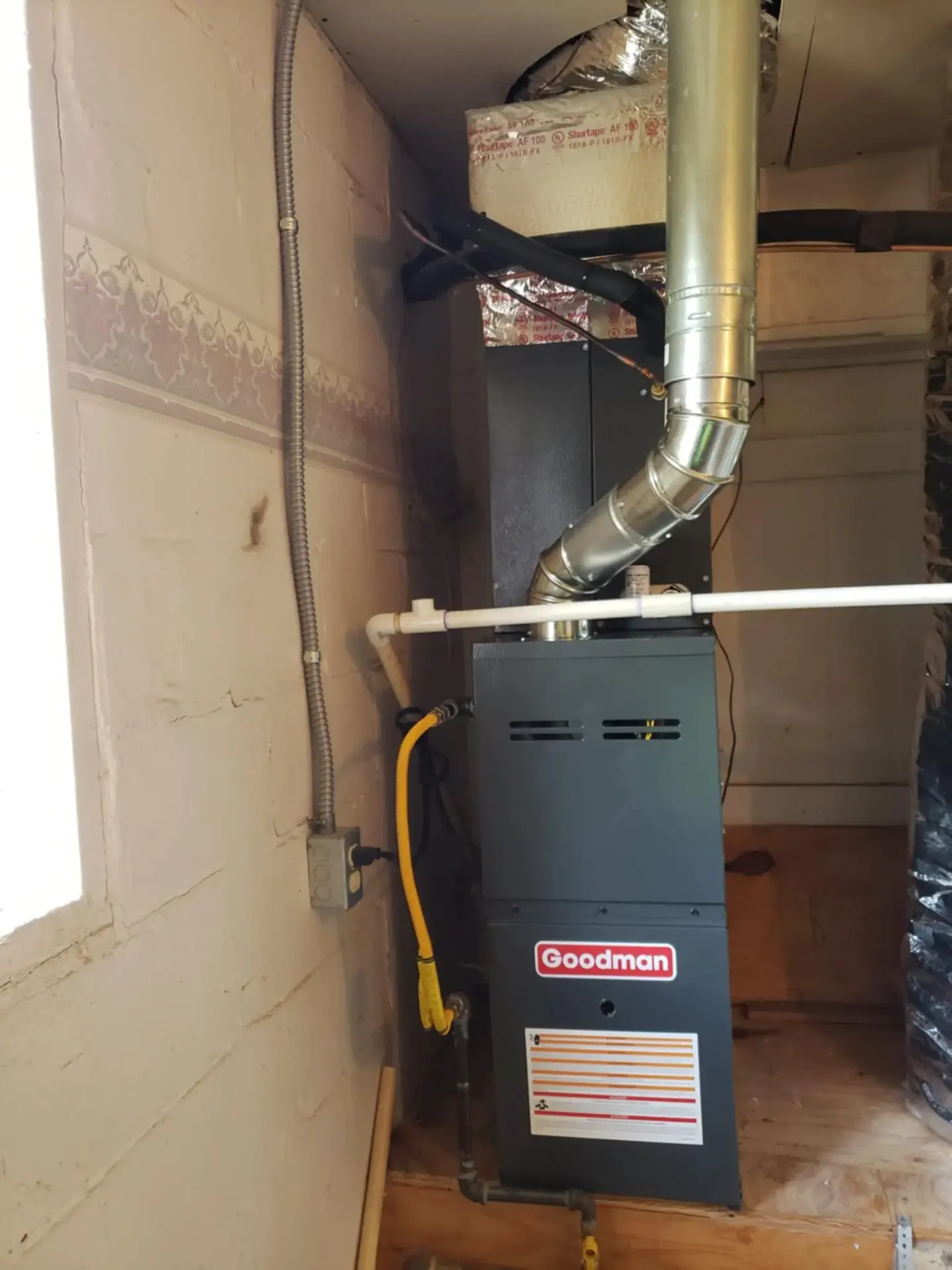 High-Efficiency Furnace Replacement Claremore Oklahoma New high-efficiency Goodman furnace installation replacing old system in Claremore