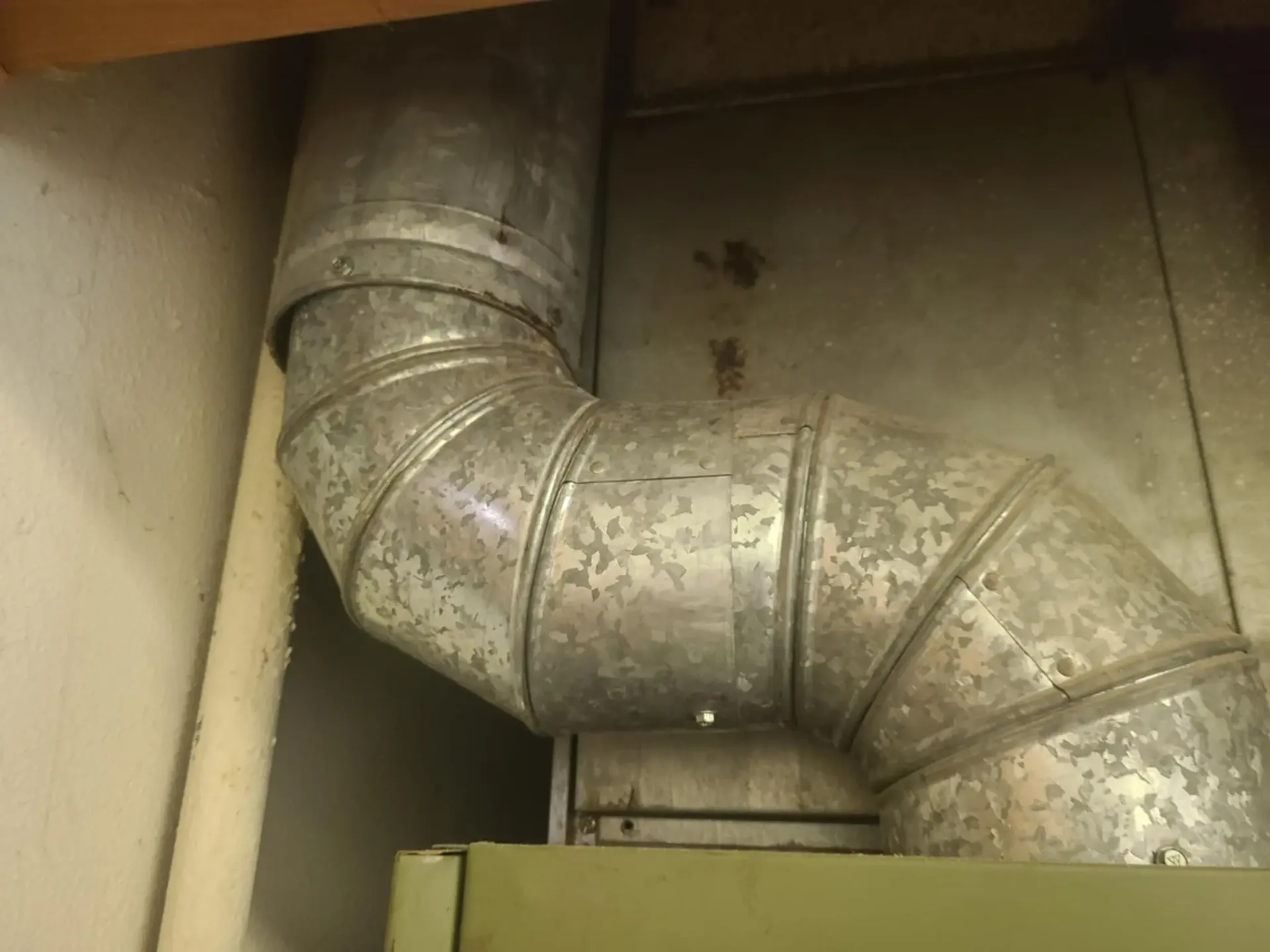Damaged flue pipe requiring immediate furnace safety repair in Claremore home